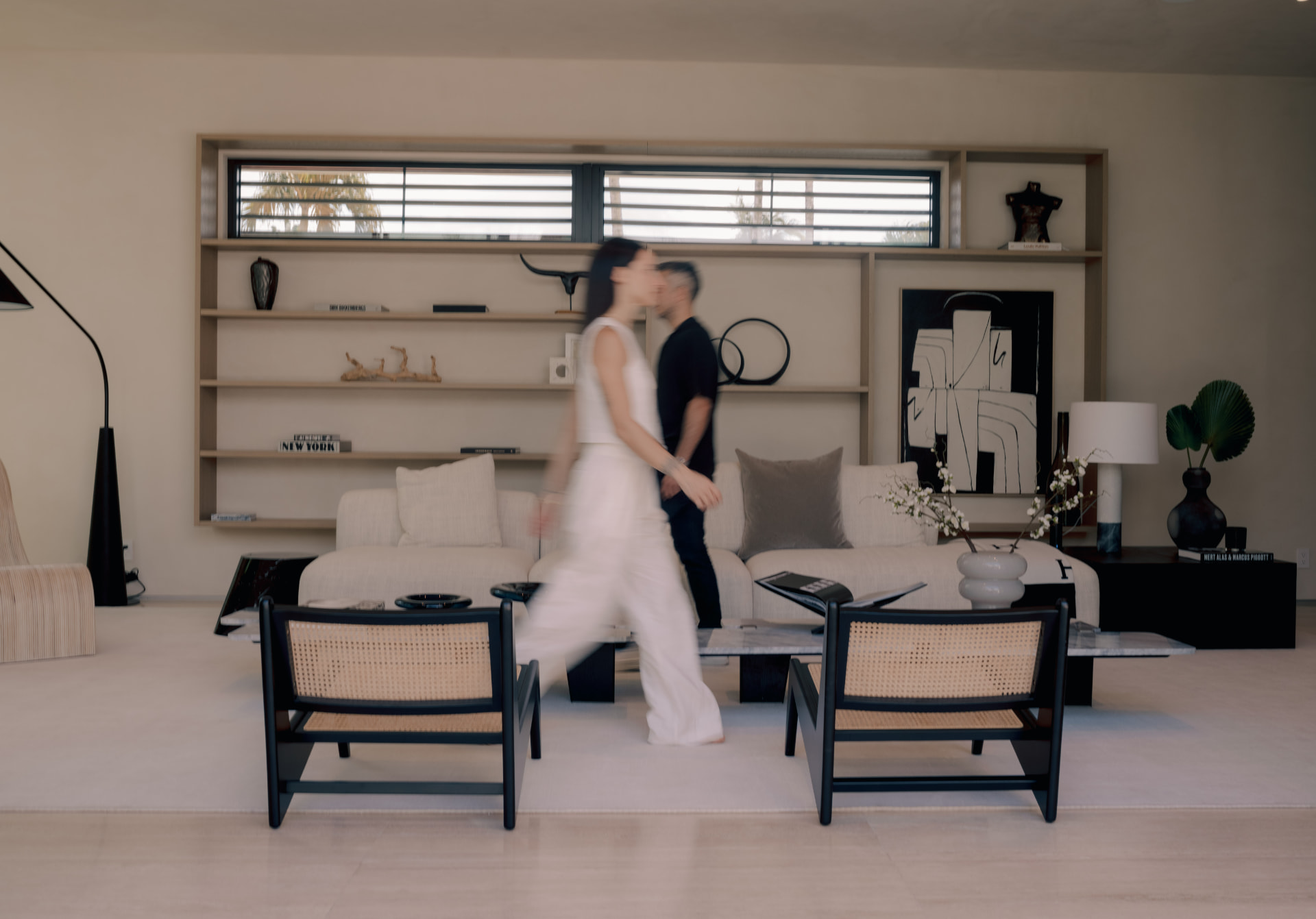 Gaia Sonzogni and Jorge Campodonico walking through a home